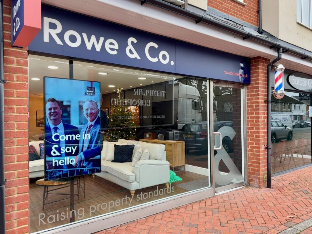 estate agents window with digital screen displays