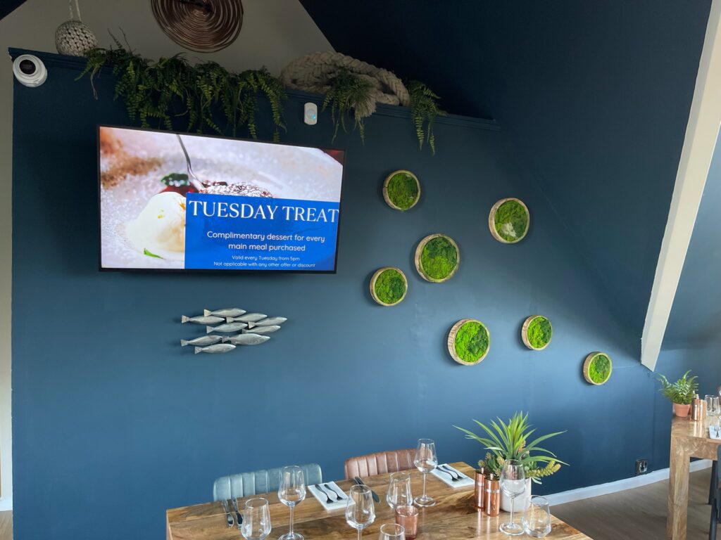 Digital signage display in a restaurant showing a meal deal.